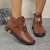 Women’s fashion boots displayed on rustic wood